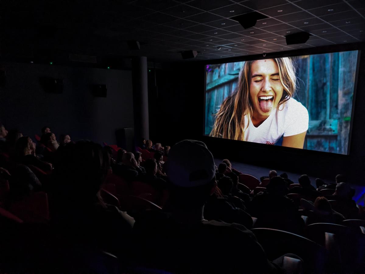 Audience watching Lonely Fans in the theater